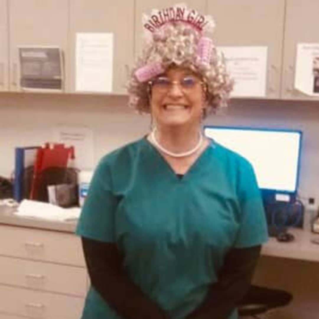 woman wearing a wig and headband